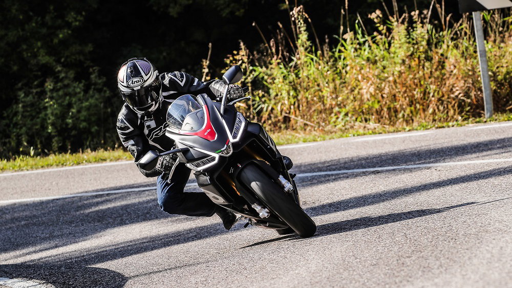 Aprilia RS660 riding up Alpine mountain road